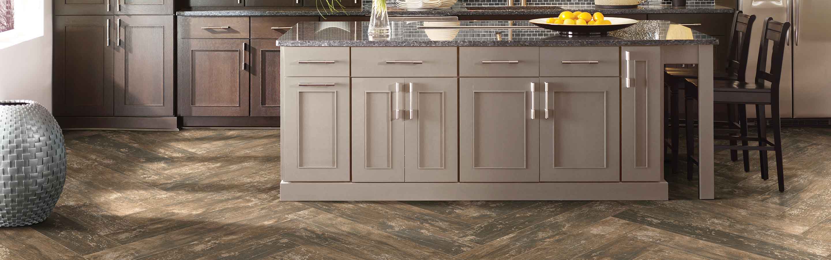 Wood-look tile floors in a brown toned kitchen